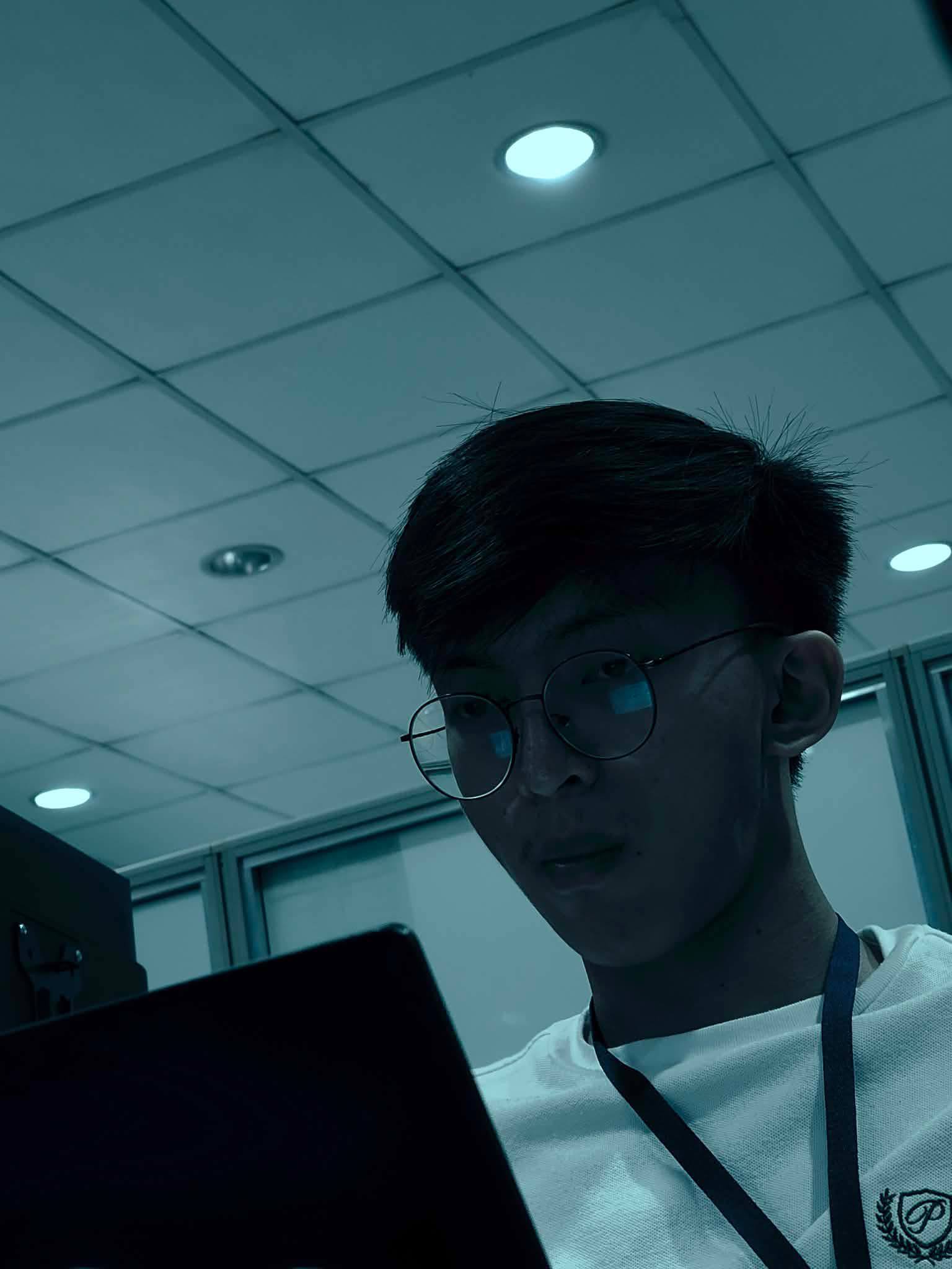 Mohammad Abdulmanan coding on a laptop